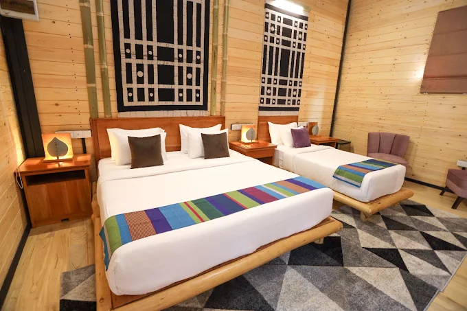 Deluxe wooden guest room with double and single beds at The Feel Hotel Ella