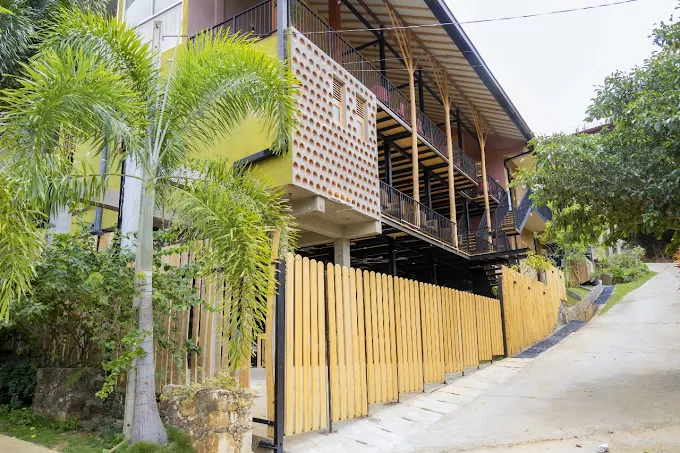 Modern facade of The Feel Luxury Boutique Hotel Ella with wooden branch pillars