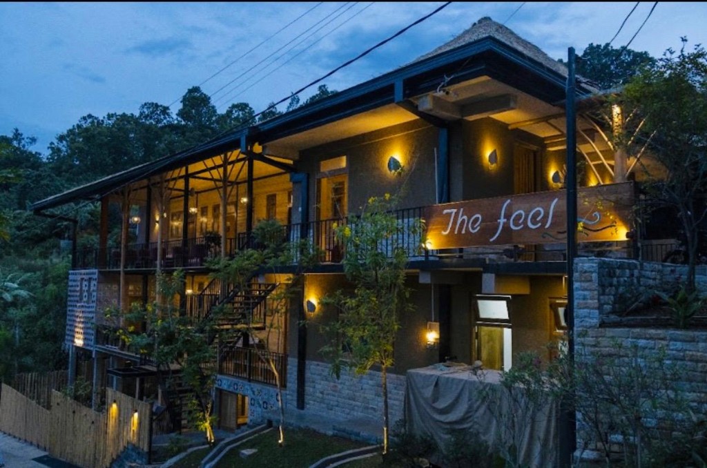 The Feel Luxury Boutique Hotel Ella facade lit warmly at dusk